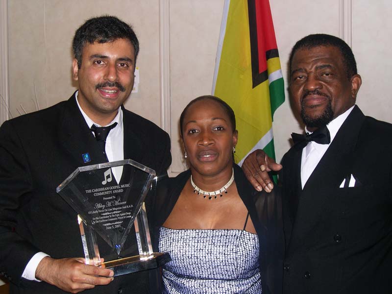 Dr Abbey being Presented Gl Award by Hopeton lewis 2001 