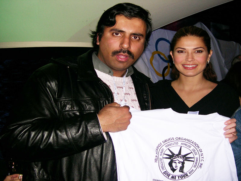 Miss Universe 2002 Holding UP our Tee Shirt 2002 